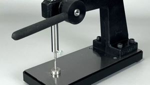 Eyelet press used to set eyelets.
