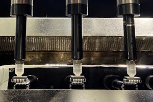 Figure 4. Robotic PLCC component tinning.