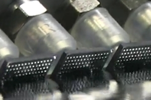 Figure 4. Closeup robotic system removing old solder balls from BGA components.