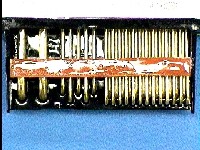 Conformal coating remains on connector body and leads beyond the critical contact area.