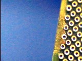 Photo 3: Damaged and frayed material removed to prepare the circuit board surface for epoxy repair.