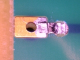 Figure 2. Copper ribbon soldered to exposed inner layer.