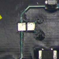 Figure 3: New pads bonded in place, lap soldered, and joint sealed with high strength, thermoset epoxy.